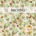 A swatch of mottled cream fabric with falling green and brown leaves with tossed acorns. A banner at the top reads 