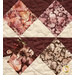 A super close up shot of the patchwork of the quilt, showcasing fabric, piecing, and top stitching details.