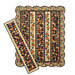 The completed Pumpkin Lane Quilt colored in rich orange, brown, blue, tan, and red fabrics from the Wheatland collection by Moda Fabrics, as well as the bonus table runner project, isolated on a white background.