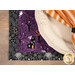 A super close-up on the placemat, demonstrating details on the purple and gray fabrics.