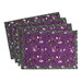The four completed Self-Binding Placemats, fanned out and colored in purple and gray fabrics from the Witchy Woods collection by Lewis & Irene, isolated on a whitebackground.