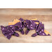 A top down shot of the completed napkins colored in purple and orange Halloween-themed fabrics from the Witchy Woods collection, staged on a wooden table.