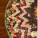 A super close up on the project, showcasing the various autumn themed prints used on the folded points and binding.