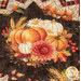 A super close up on the center of the project, showcasing a scene with bright pumpkins and florals.