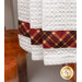 A super close up on the red plaid fabric stripe at the bottom of the towel.