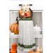 The completed Pumpkins themed hanging towel, colored in bright fall fabrics from the Gather With A Grateful Heart collection by Timeless Treasures Fabrics, staged on a kitchen drawer with coordinating decor.