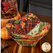 The three stacked bowl cozies, staged on a warm wooden table with coordinating decor and pumpkins.