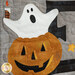 A close up on laser shape decorations on the E block, featuring a ghost popping out of a jack-o-lantern.