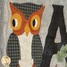 A close up on laser shape decorations on the A block, featuring a perched owl.
