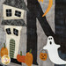 A close up on laser shape decorations on the N block, featuring a ghost trick-or-treating at a haunted house.