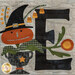 A close up on the other E block, featuring a grinning pumpkin plant wearing a witch hat.