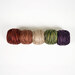 A top-down shot of the threads rolled together in a line, isolated on a white background.