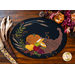 Wool placemat with appliqué of a horn filled with fruits and a pumpkin.