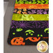 A super close up on the patchwork of the drying mat, showing details on the Halloween-themed batik prints.