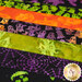 A super close up on the patchwork of the drying mat, showing details on the Halloween-themed batik prints.