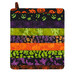 The completed Dry Ideas dish drying mat colored in black, green, purple, and orange fabrics from the Tonga Haunted Batiks collection, isolated on a white background.