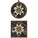 The two completed Folded Star Hot Pads in black, isolated on a white background.