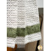 A super close up on the fabric stripe at the bottom of the towel.