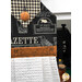 A head on shot of the top of the towel, demonstrating details on the newspaper and Halloween fabrics and the orange fabric button.