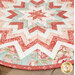 A close up on the table topper, demonstrating fabric colors and print details on the folded points.