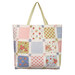The finished magic charm pack tote kit made from blue, pink, green, and white fabric from the Memory Lane collection by Moda isolated on a white background.
