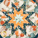 A super close up on the center folded star detail of the hot pad, showing print details and folded star elements.