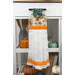 The Hanging Towel, colored in cream, blue, and orange fabrics from the I Love Fall Most of All collection, staged on a white kitchen drawer with coordinating decor.