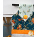 A super close up on the top of the towel, showing color and print details on the aqua and blue fabrics.