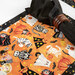 The Boo Crew placemat staged with a coordinating black cloth napkin.