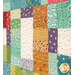A stylized close-up image on the patchwork, showcasing the fabric and top quilting details.