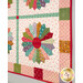 A stylized close up on the wall hanging, demonstrating fabric colors and details.