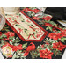 A close up on the middle of the runner, showing details on the floral fabrics. Coordinating décor pairs with complementary table settings.