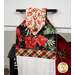 A super close up on the top of the towel, showing color and print details on the black, red, and cream fabrics.