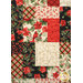 A head-on super close up on the patchwork of the quilt, demonstrating fabric colors and floral print details as well as top stitching effects.