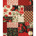 A head-on super close up on the patchwork of the quilt, demonstrating fabric colors and floral print details as well as top stitching effects.