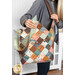A model holds the Mondo bag over their shoulder, demonstrating size and scale of the bag.