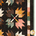A close up on one of the patchwork leaf blocks, showing fabric color and print details.