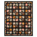 The completed Leaf Pile quilt, colored in autumn themed fabrics from the Acorn Hollow collection, isolated on a white background.