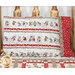 The completed Magic Pillowcase colored in gray, white, red, and green flannel fabrics from The Christmas Mouse collection by Northcott Fabrics, staged on a wood log bed with the coordinating Merry Mouse-mas quilt.
