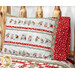 A slightly angled shot of the pillowcase on the wood log bed, demonstrating fabric print and color details.