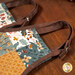 A super close up on the handles of the apron hot pad, showing details on the fabric colors and details.