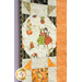A close up on an outer block of the quilt, demonstrating fabric, piecing, binding, and top quilting details.