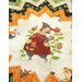 A super close up angled shot of the folded star center, showcasing the cream fabric with a witch standing in her garden with stalks of enchanted pumpkins.