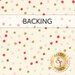 A swatch of cream fabric with red, gold, pink, blue, and green scattered polka dots. A banner at the top reads 