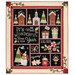 The completed The Most Wonderful Time BOM quilt decorated in red, green, and black Christmas fabrics from the Glisten collection, isolated on a white background.