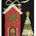 A close up on one of the window blocks, showcasing a decorated house and festive tree.