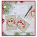 The completed project, a christmas card with two cardinals, staged with coordinating holiday decor.