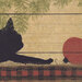 An 8x8 swatch of the panel fabric featuring a cat playing with a red ornament.