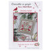 Front of pattern showing a picture of the completed project staged with christmas decor.