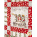 A super close up on one of the patchworked panel scenes, bordered by red snowflake and garland themed fabrics.